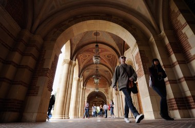 Students walk near Royce Hall on the University of California–Los Angeles campus in Los Angeles, California.