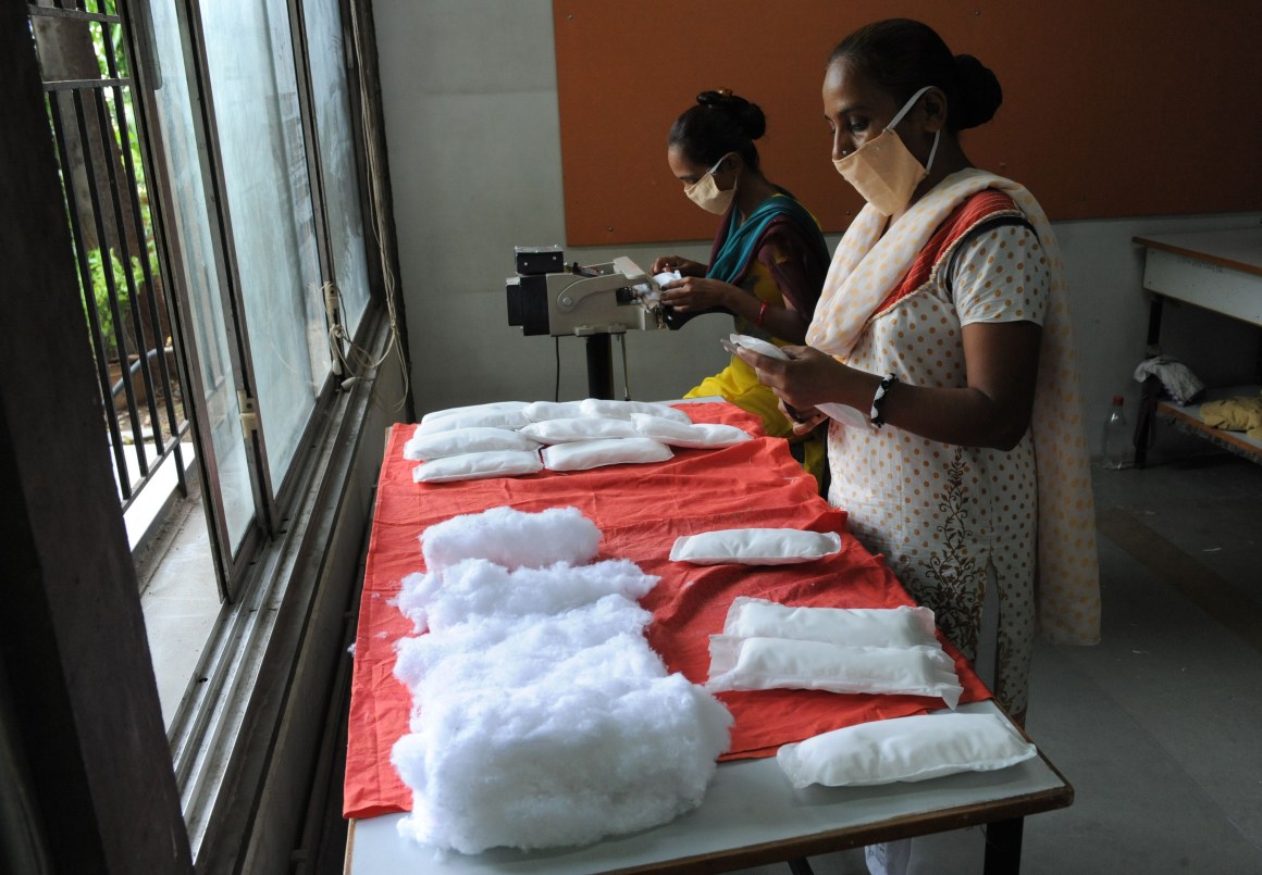 Members of the Self Employed Women's Association (SEWA) make low-cost sanitary pads at their facility in Ahmedabad, India, on September 3rd, 2012. Prompted by the widespread suffering of women and girls in rural areas who continue to be plagued by unhygienic old cloth pieces or rags during their menstrual cycle periods, SEWA is manufacturing low-cost sanitary pads with a production capacity at 2,000 pads per day.