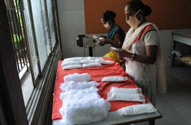 Members of the Self Employed Women's Association (SEWA) make low-cost sanitary pads at their facility in Ahmedabad, India, on September 3rd, 2012. Prompted by the widespread suffering of women and girls in rural areas who continue to be plagued by unhygienic old cloth pieces or rags during their menstrual cycle periods, SEWA is manufacturing low-cost sanitary pads with a production capacity at 2,000 pads per day.