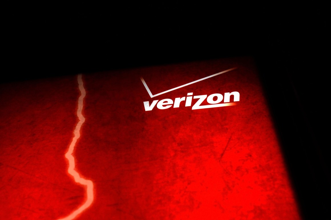 A Verizon advertisement is viewed outside of a store on June 7th, 2013, in New York City.