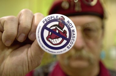 A man protests using Native Americans as mascots for sports teams at the 10th Annual New Years Eve Sobriety Powwow in 2003.