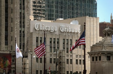 Flags fly along the Michigan Avenue bridge near the Tribune Tower, home of the Chicago Tribune, WGN Radio and the Tribune Company, on July 10th, 2013 in Chicago, Illinois.