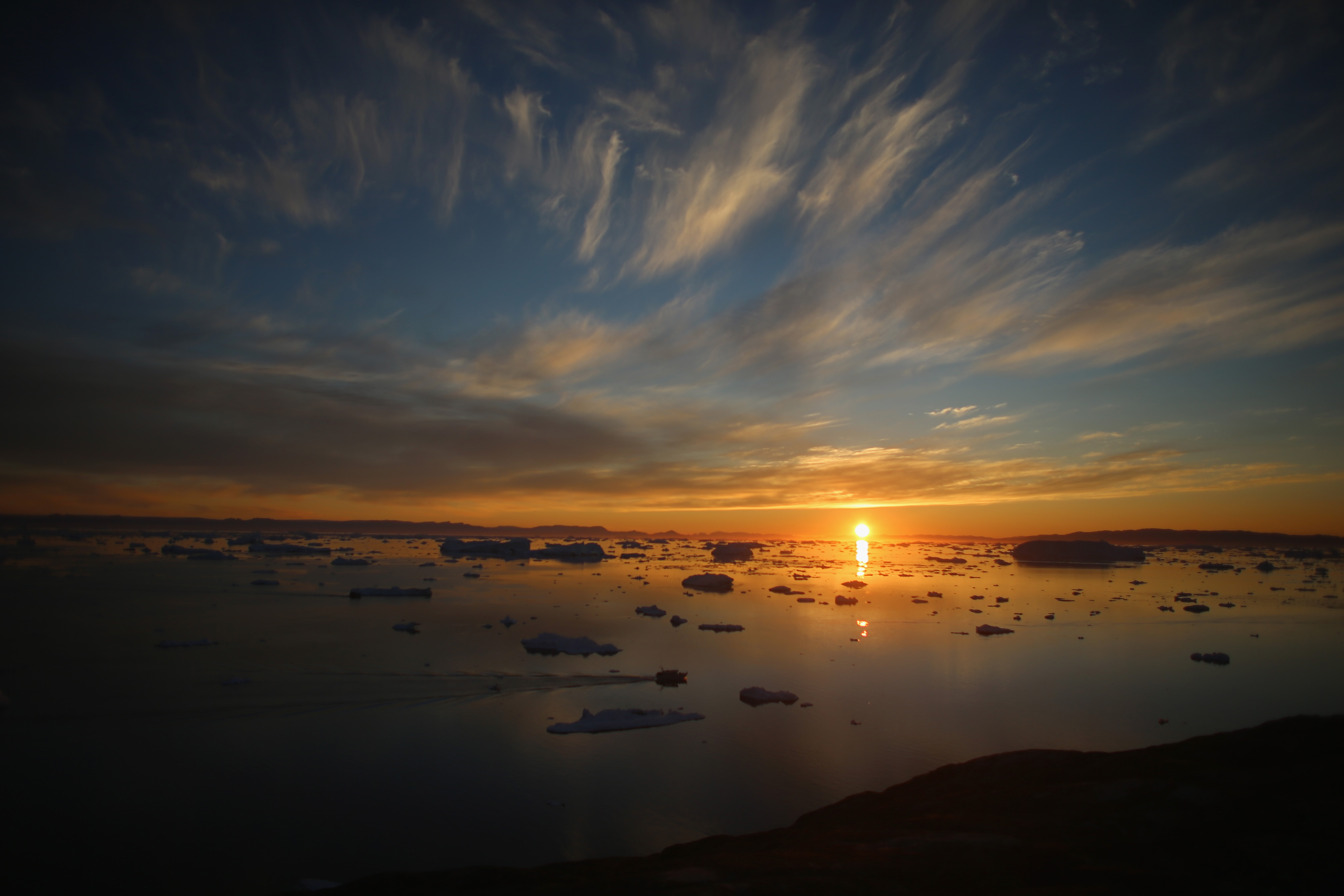 Icebergs that broke off from the Jakobshavn Glacier float in the water on July 23rd, 2013, in Ilulissat, Greenland.