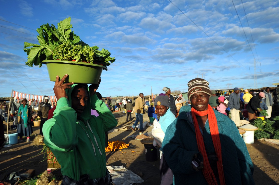 Zimbabwean women shop for vegetables in Jambanja market in Seke, south of Harare.