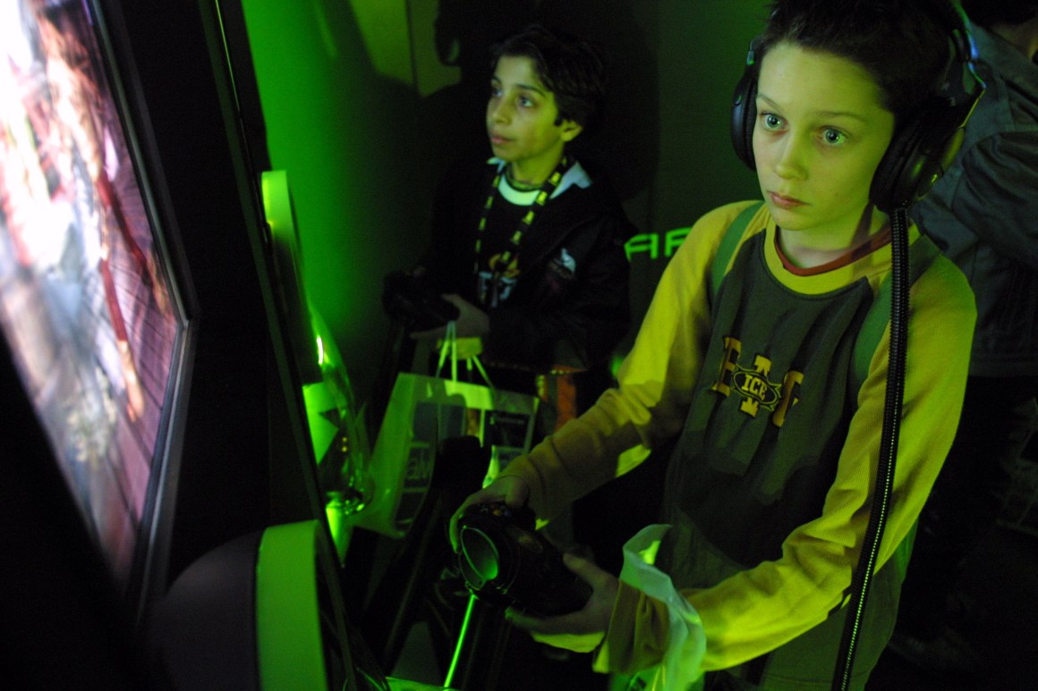 Visitors play with Microsoft's Xbox gaming system at the CeBIT technology trade fair March 12th, 2003, in Hanover, Germany.