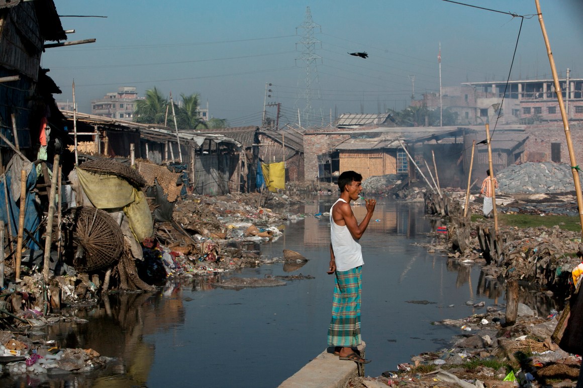 Dhaka, Bangladesh: Momin Mohammad, a leather worker, brushes his teeth by a canal near his home in the city's polluted Hazaribagh neighborhood. Each day, tanneries dump 22,000 liters of toxic waste into the Buriganga, the capital city's main river and key water supply.