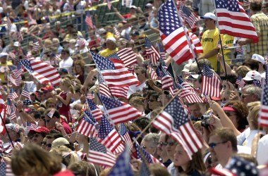 Supporters wave U.S. flags as they attend the Rally for America event at Marshall University stadium on May 24th, 2003, in Huntington, West Virginia.