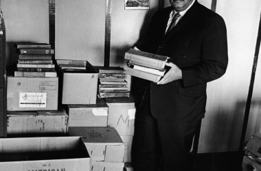 Civil rights activist Reverend Francis Griffin holds school books donated for the private schooling of black children, circa 1959. Prince Edward County, Virginia, shut down its public school system to avoid having to desegregate.