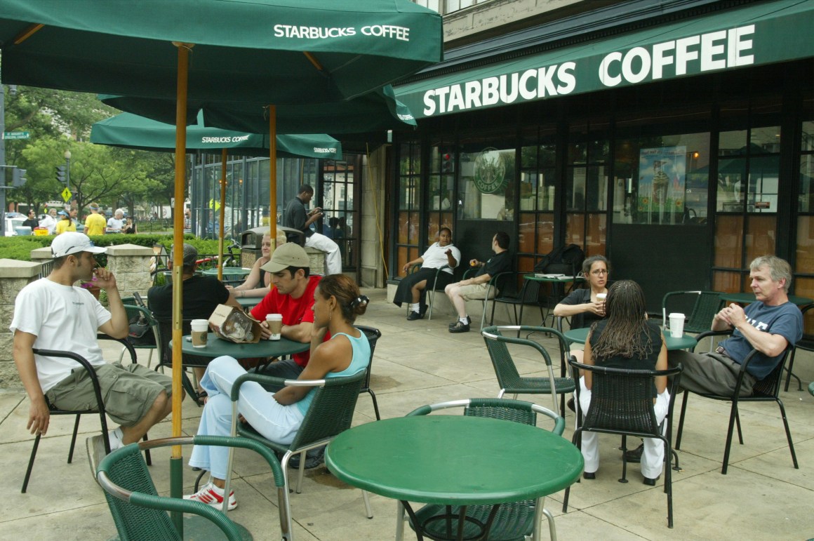 Customers sit outside a Starbucks in Washington, D.C.