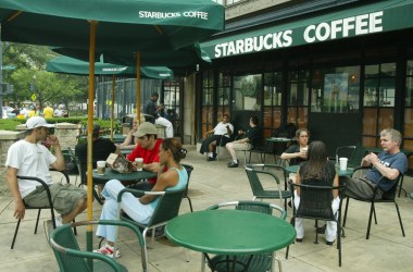 Customers sit outside a Starbucks in Washington, D.C.