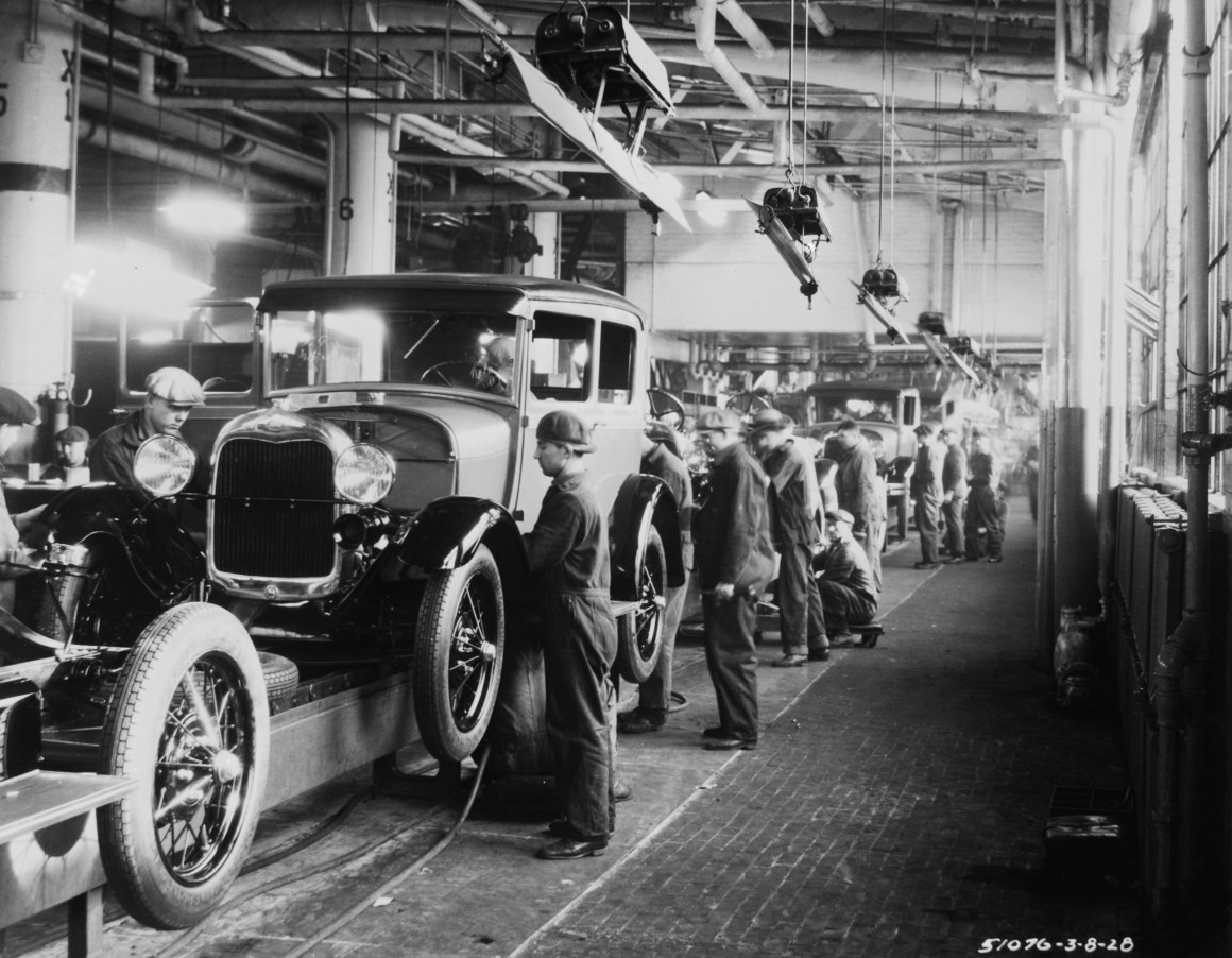 Assembly line workers inside the Ford Motor Company factory in Dearborn, Michigan.