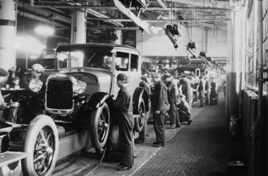 Assembly line workers inside the Ford Motor Company factory in Dearborn, Michigan.