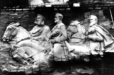 Giant figures sculptured in granite rock on Stone Mountain in Atlanta, Georgia. The figures represent Jefferson Davis, the only president of the Confederate States of America with Confederate Generals Robert E Lee and Stonewall Jackson.