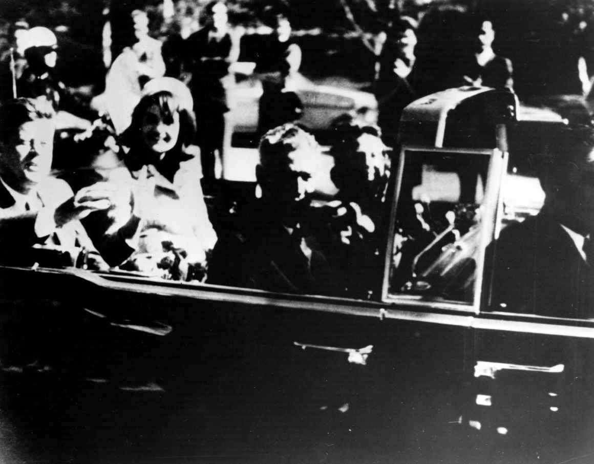 President John F. Kennedy and his wife Jacqueline ride with secret agents in an open car motorcade shortly before the president was assassinated in Dallas, Texas, on November 22nd, 1963.