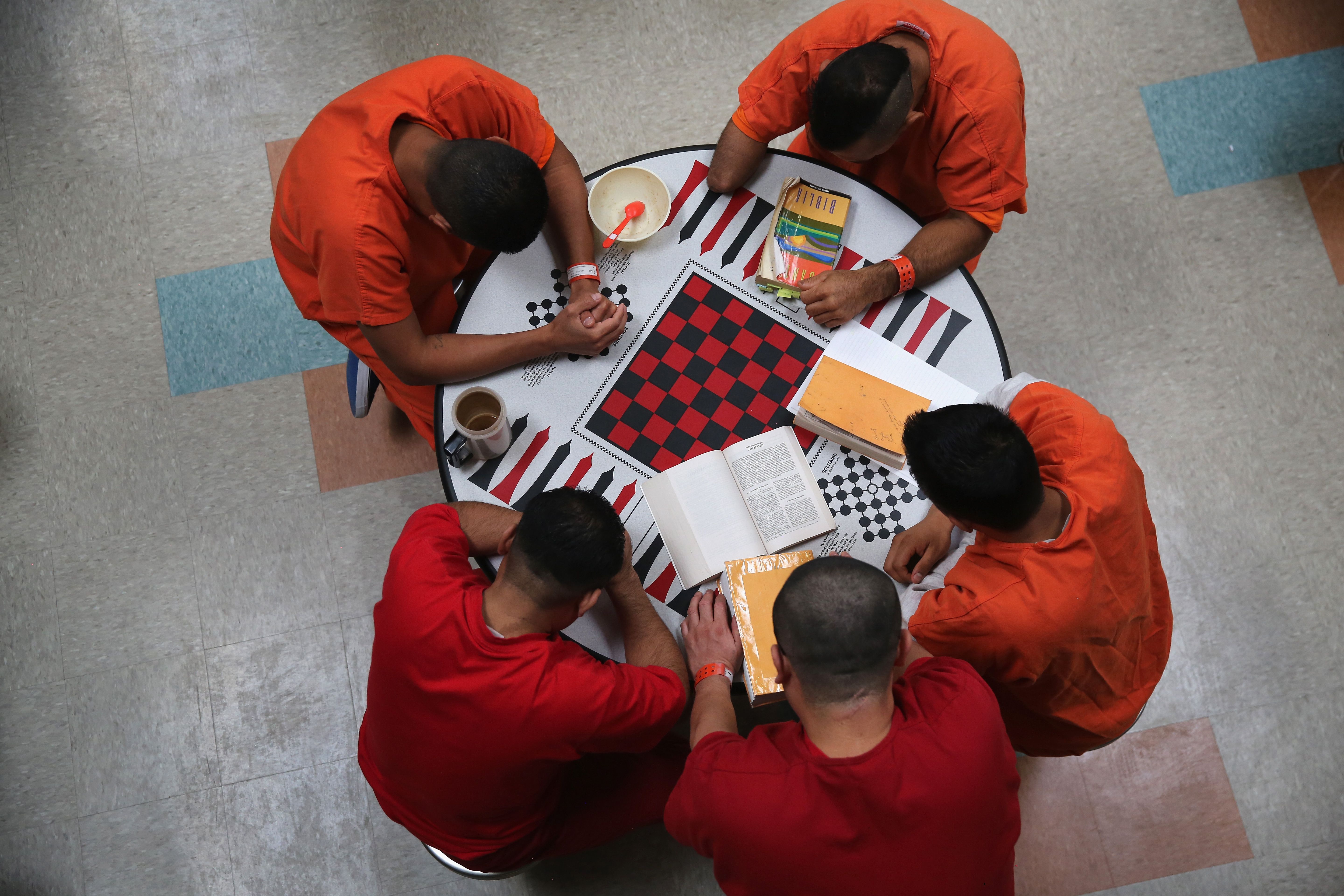 Immigrant detainees at the Adelanto Detention Facility engage in prayer.