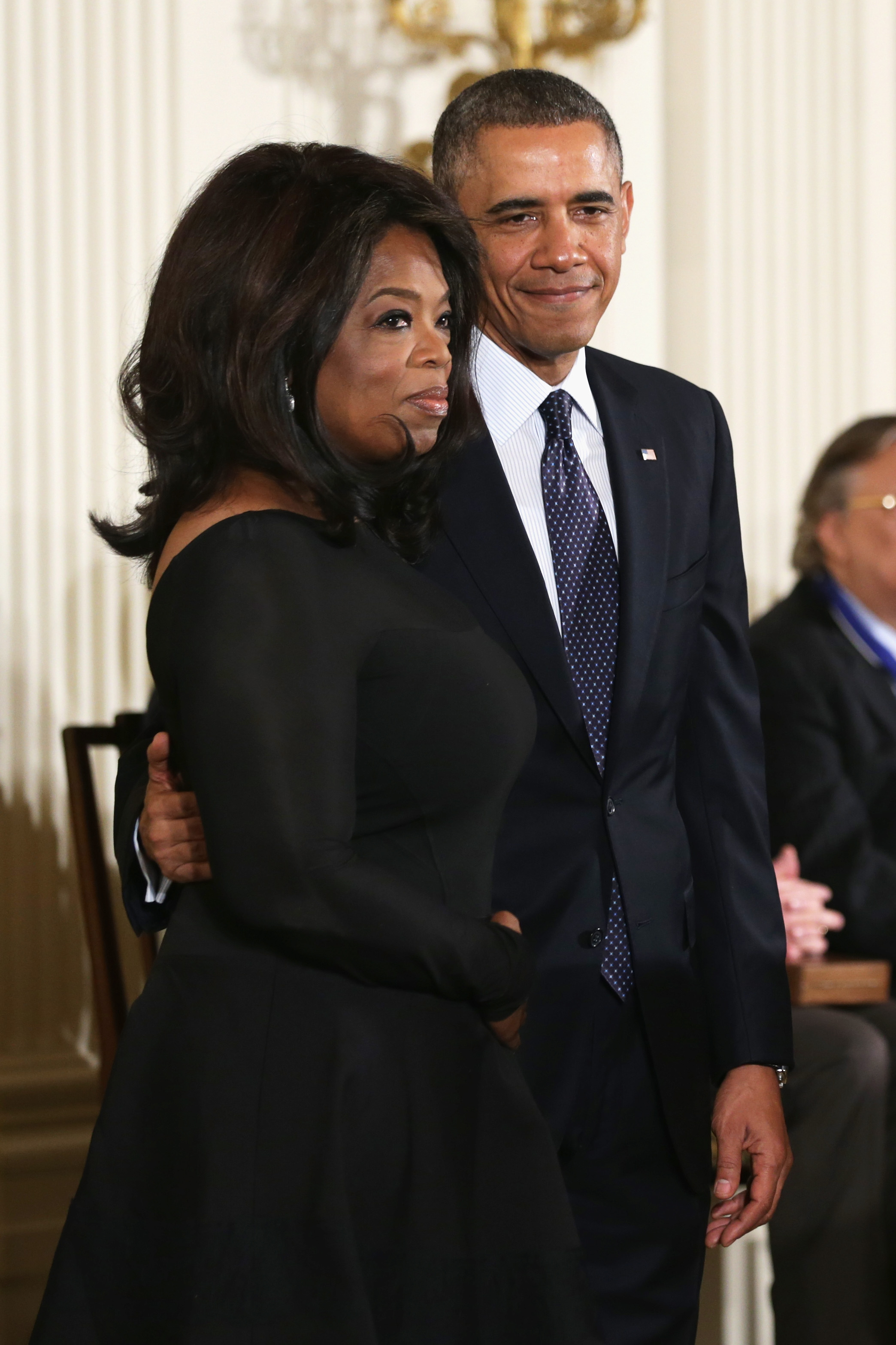 President Barack Obama and Oprah Winfrey on stage before Winfrey receives the Presidential Medal of Freedom in the East Room at the White House on November 20th, 2013, in Washington, D.C.