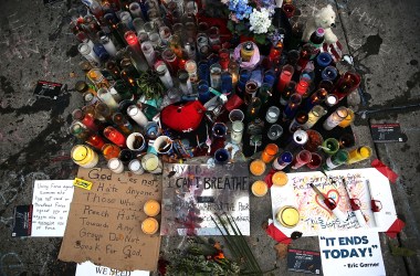 A growing memorial for Eric Garner near where he died after he was taken into police custody in Staten Island on July 22th, 2014, in New York City.