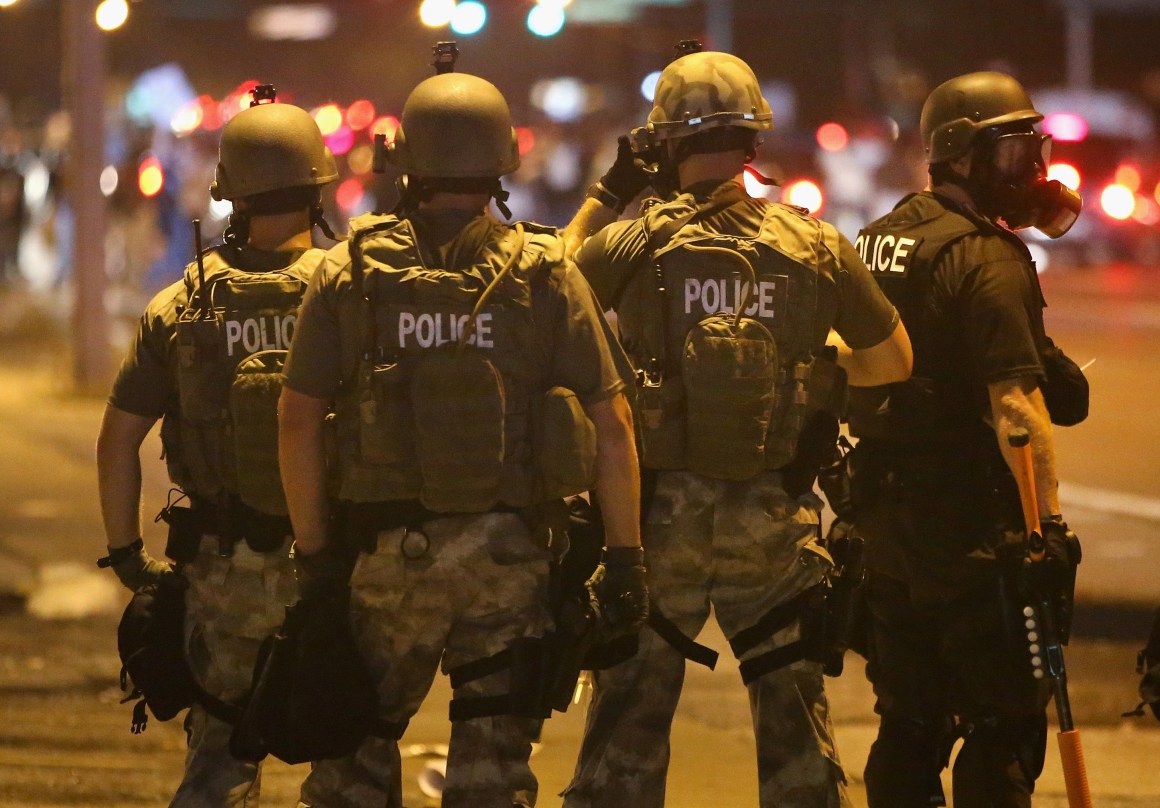 Police advance on demonstrators protesting on August 17th, 2014, in Ferguson, Missouri.