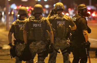 Police advance on demonstrators protesting on August 17th, 2014, in Ferguson, Missouri.