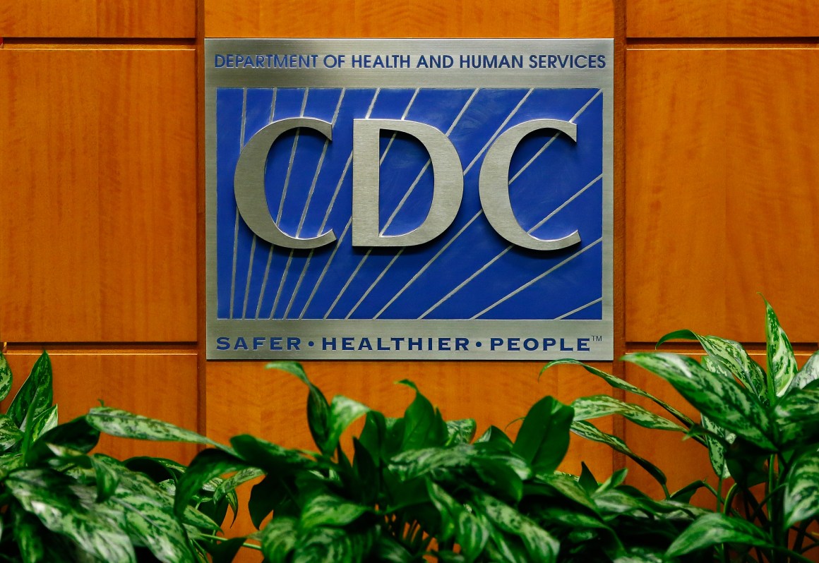 A podium with the logo for the Centers for Disease Control and Prevention.