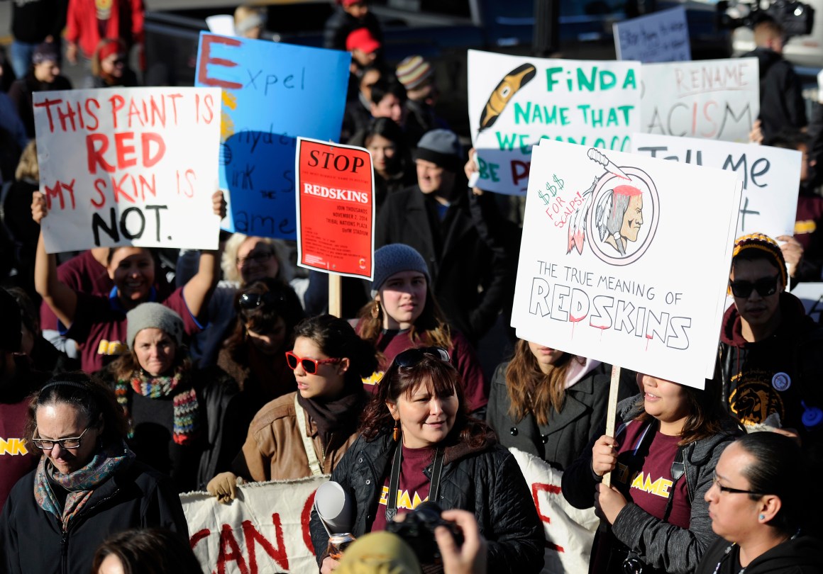 People march in protest against the mascot for the Washington Redskins before the team's game against the Minnesota Vikings on November 2nd, 2014, in Minneapolis, Minnesota. Opponents of the Redskins name say it's a slur that mocks Native American culture and they want the team to change it.