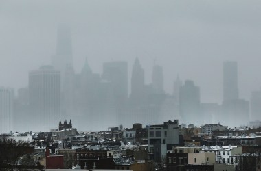 The New York City skyline, shrouded in snow and fog.