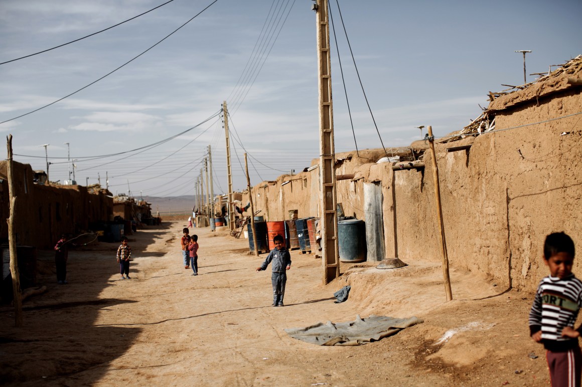 Afghan children wander at the Shahid Nasseri refugee camp in Taraz Nahid, near the city of Saveh, some 130 kilometers southwest of the capital of Tehran, Iran.