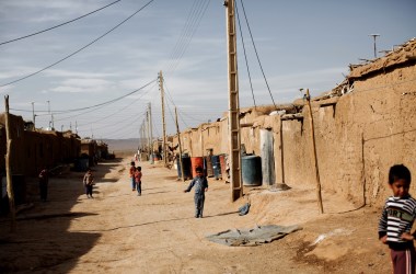 Afghan children wander at the Shahid Nasseri refugee camp in Taraz Nahid, near the city of Saveh, some 130 kilometers southwest of the capital of Tehran, Iran.