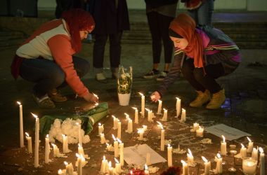 A makeshift memorial is made on February 11th, 2015 in Chapel Hill, North Carolina, after a vigil at the University of North Carolina following the murders of three Muslim students. Craig Stephen Hicks, who perpetrated the killings, was sentenced on three counts of first degree murder in June of 2019.