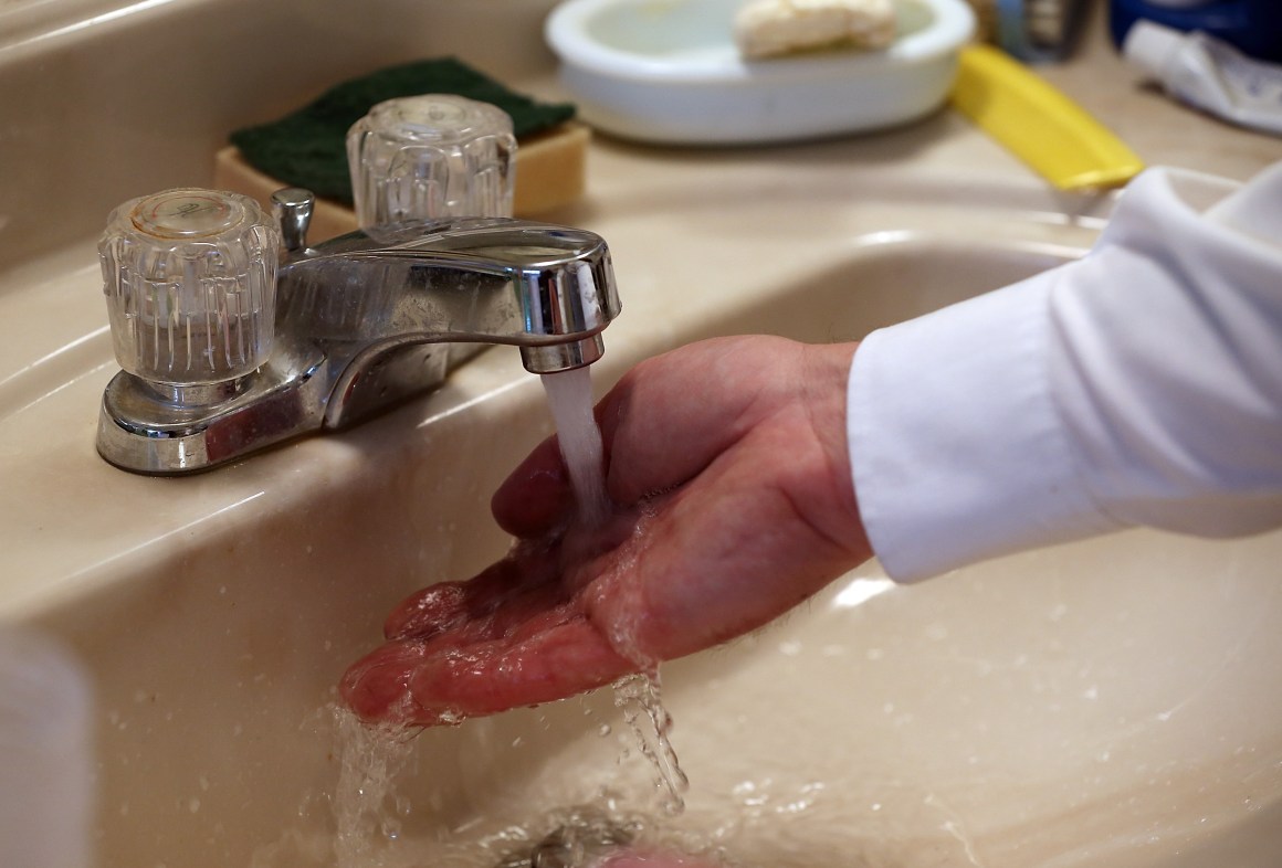 Plumbing technician Todd Snider tests the flow of water after installing an aerator at a home on February 5th, 2014, in Novato, California. Many Californians have installed water-saving devices in their homes like low-flow toilets, shower heads, and aerators.