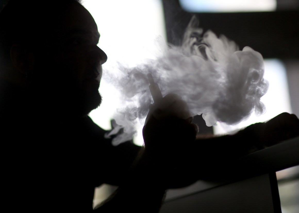 Michael Crespo enjoys an electronic cigarette at the Vapor Shark store on February 20, 2014 in Miami, Florida.