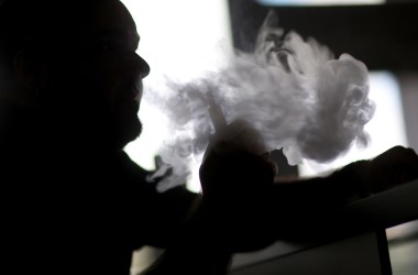 Michael Crespo enjoys an electronic cigarette at the Vapor Shark store on February 20, 2014 in Miami, Florida.