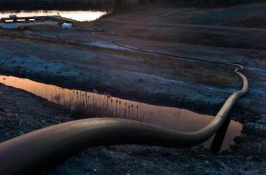 A water intake pipe for oil sands operations leads downhill to the Athabasca River on April 28th, 2015, north of Fort McMurray, Canada.