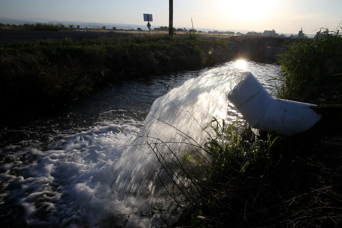 Water is pumped into an irrigation canal in Biggs, California.