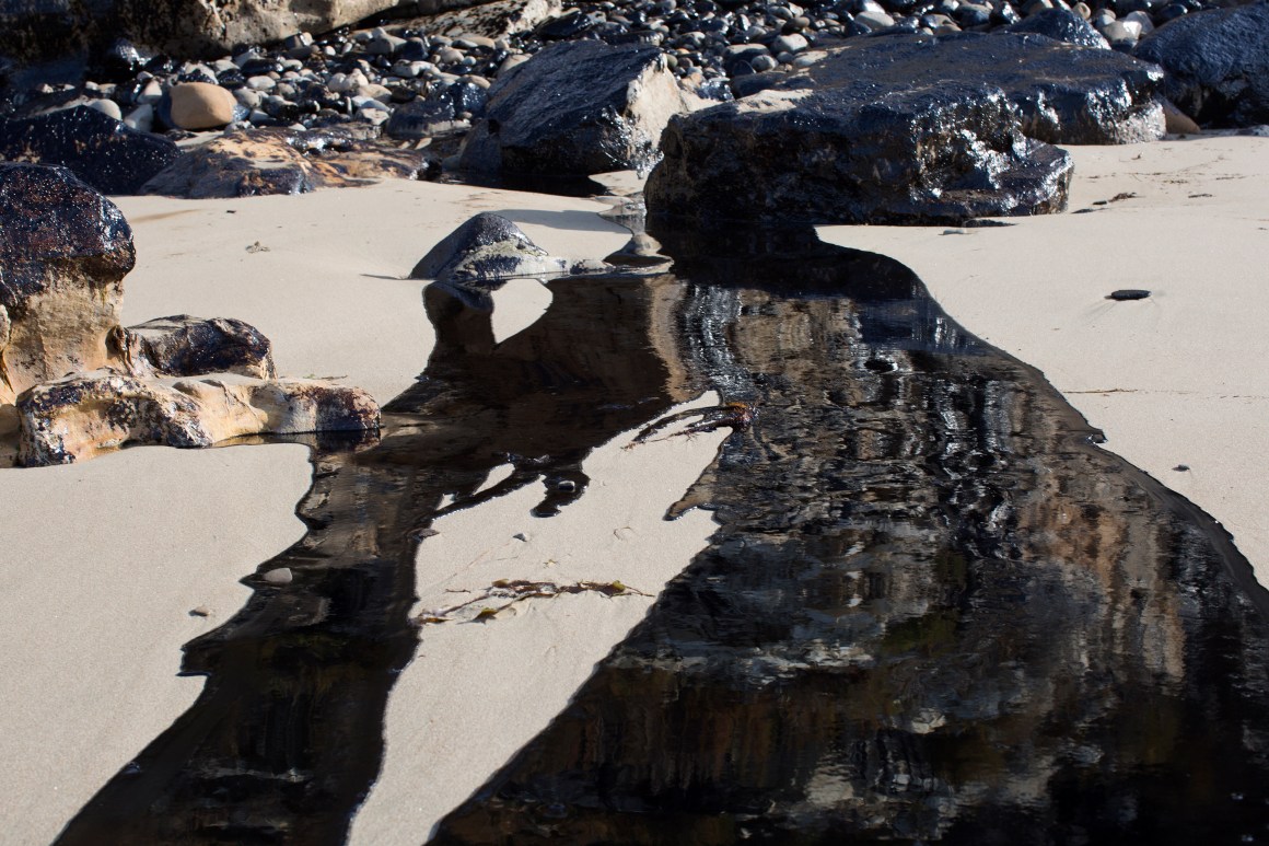 Oil flows toward the ocean from an inland oil spill near Refugio State Beach on May 20th, 2015, north of Goleta, California.