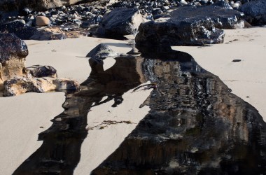 Oil flows toward the ocean from an inland oil spill near Refugio State Beach on May 20th, 2015, north of Goleta, California.