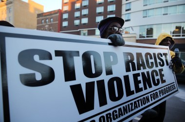 People in Newark march on the second anniversary of the death of 17-year-old Trayvon Martin on February 26th, 2014, in Newark, New Jersey.