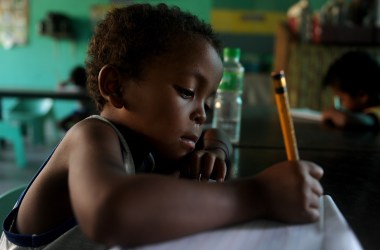 Agta children write as they attend school in Sapang Uwak, in the Philippines.