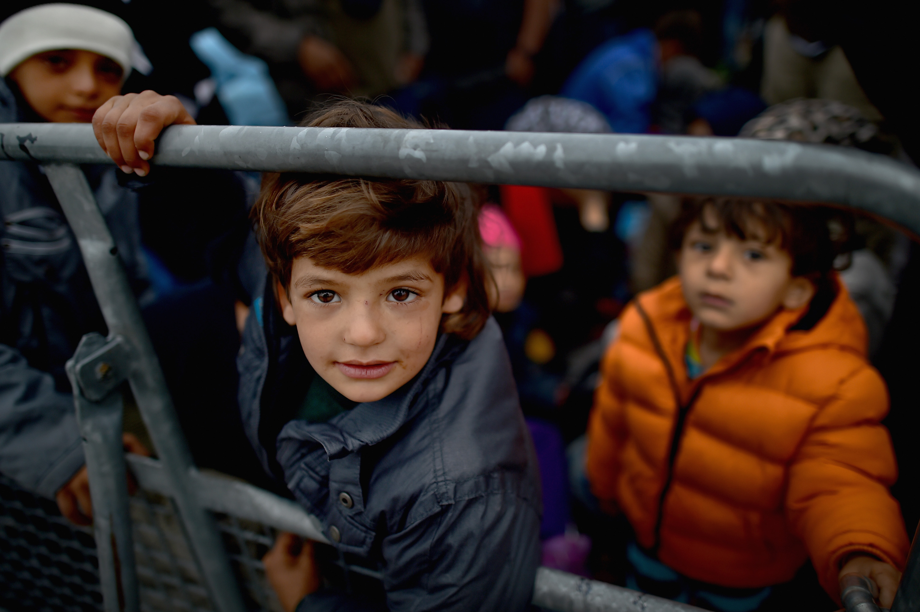 Migrants queue to board buses bound for Vienna from Hegyshalom holding center on the Austrian border.