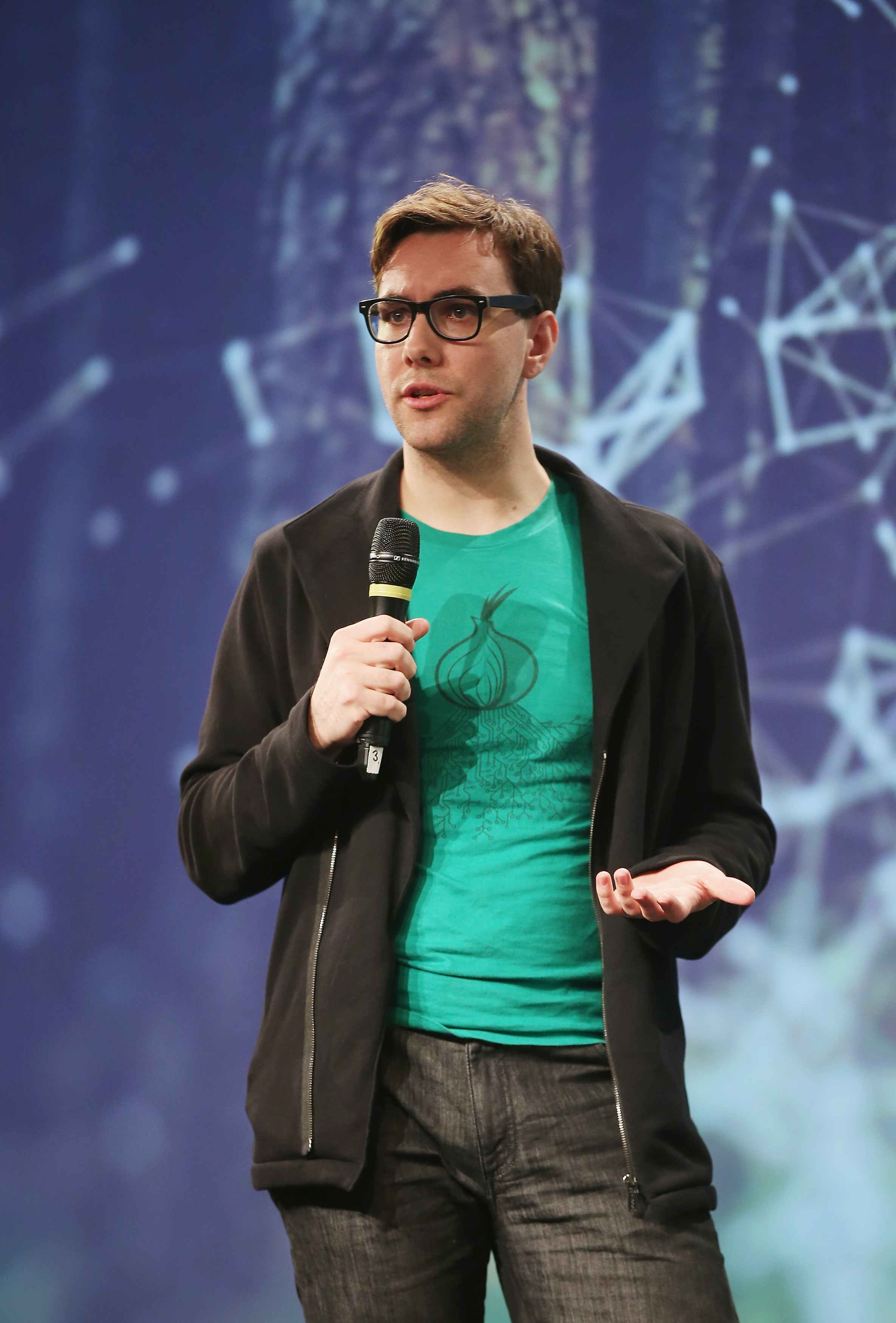 Jacob Appelbaum speaking at a conference in Germany.