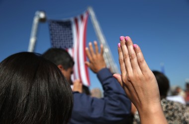 One hundred immigrants become American citizens during a naturalization ceremony at Liberty State Park on September 17th, 2015, in Jersey City, New Jersey.