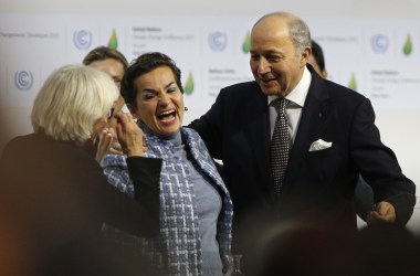 Then-Executive Secretary of the United Nations Framework Convention on Climate Change Christiana Figueres (center) celebrates with Laurence Tubiana, the French ambassador for climate (left), and Laurent Fabius, the French minister for foreign affairs (right), after adopting the historic Paris Agreement at the COP21 Climate Conference in Le Bourget, north of Paris, on December 12th, 2015.