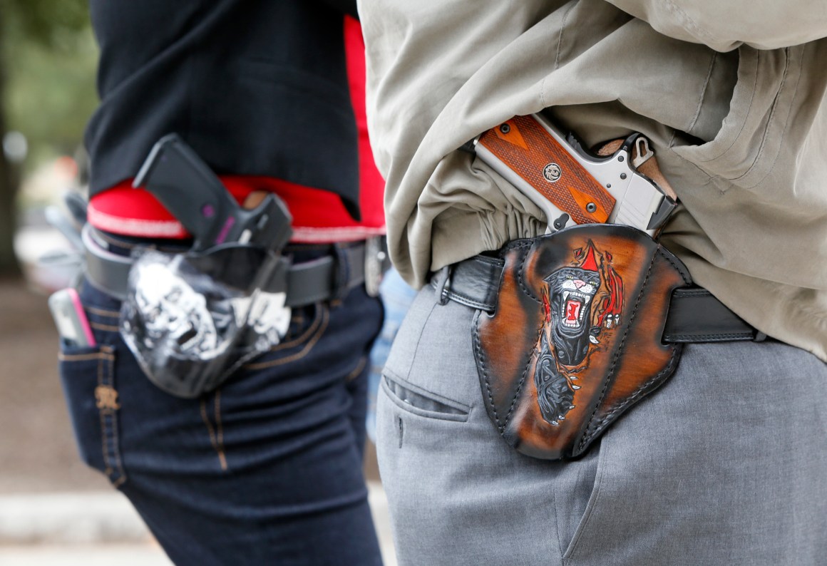 People carry pistols on January 1st, 2016 in Austin, Texas.