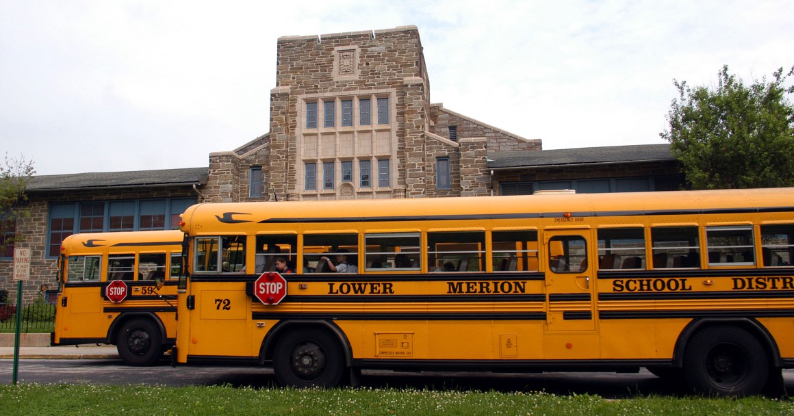 School buses stop to drop students at Merion Elementary School.