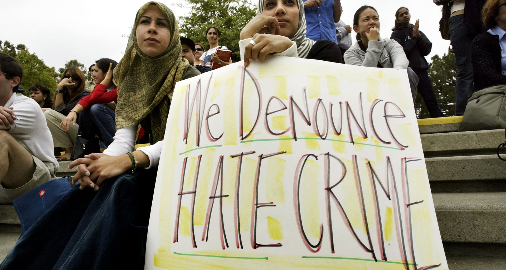 Zeena Sabri (left) and Rima Karuf join members of the Society of Arab Students at the University of California–Irvine to protest the destruction of a cardboard wall that was supposed to portray the security wall built to keep Palestinian suicide bombers out of Israel on May 27th, 2004, in Irvine, California.