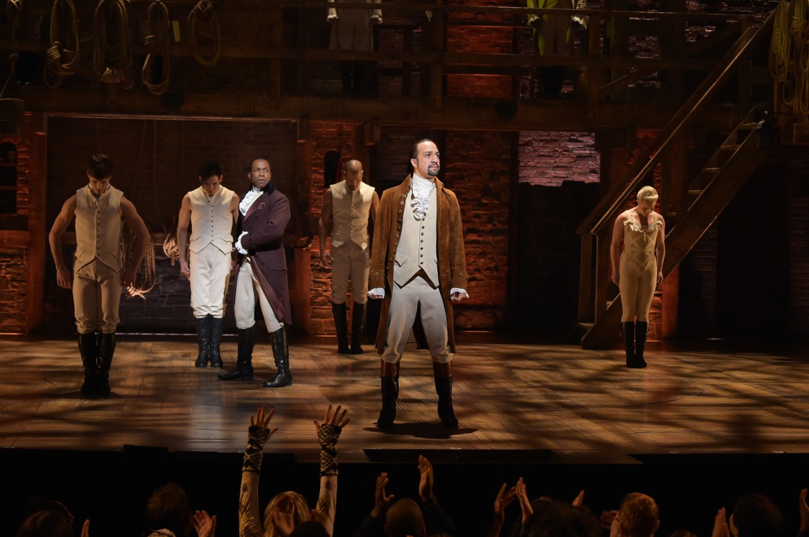 Actor Leslie Odom Jr. and actor and composer Lin-Manuel Miranda perform on stage during the Hamilton Grammy performance for the 58th Grammy Awards at Richard Rodgers Theater on February 15th, 2016, in New York City.