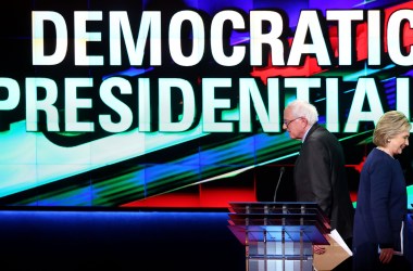 Bernie Sanders and Hillary Clinton walk off stage during a break in a primary debate on March 6th, 2016, in Flint, Michigan.