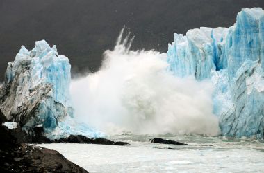 An ice bridge cracks from the wall of the Perito Moreno Glacier located at Los Glaciares National Park, in southwest Santa Cruz Province, Argentina, on March 10th, 2016.