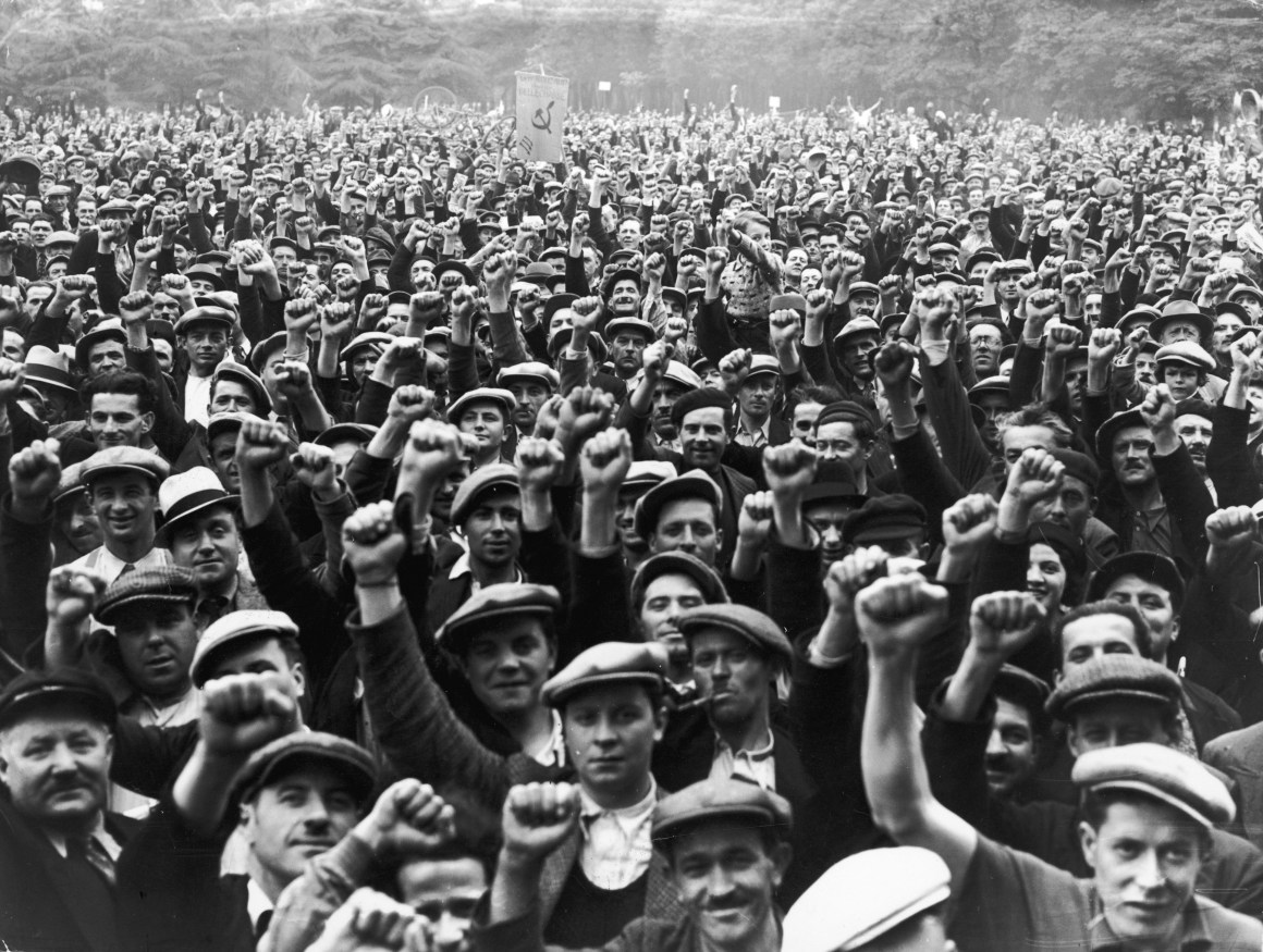 Striking building workers raise their fists in salute during a rally in Paris, on June 13th, 1936. The BLS just TKTK