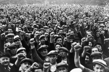 Striking building workers raise their fists in salute during a rally in Paris, on June 13th, 1936. The BLS just TKTK